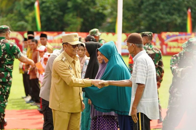 Pj Gubri Hadiri Upacara Penutupan TMMD ke-121 Tahun 2024 di Kampar