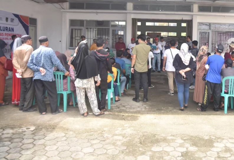 Pj Bupati Inhil Serahkan 31,320 Ton Bantuan Pangan Cadangan Beras Pemerintah Kepada Keluarga Penerima Manfaat